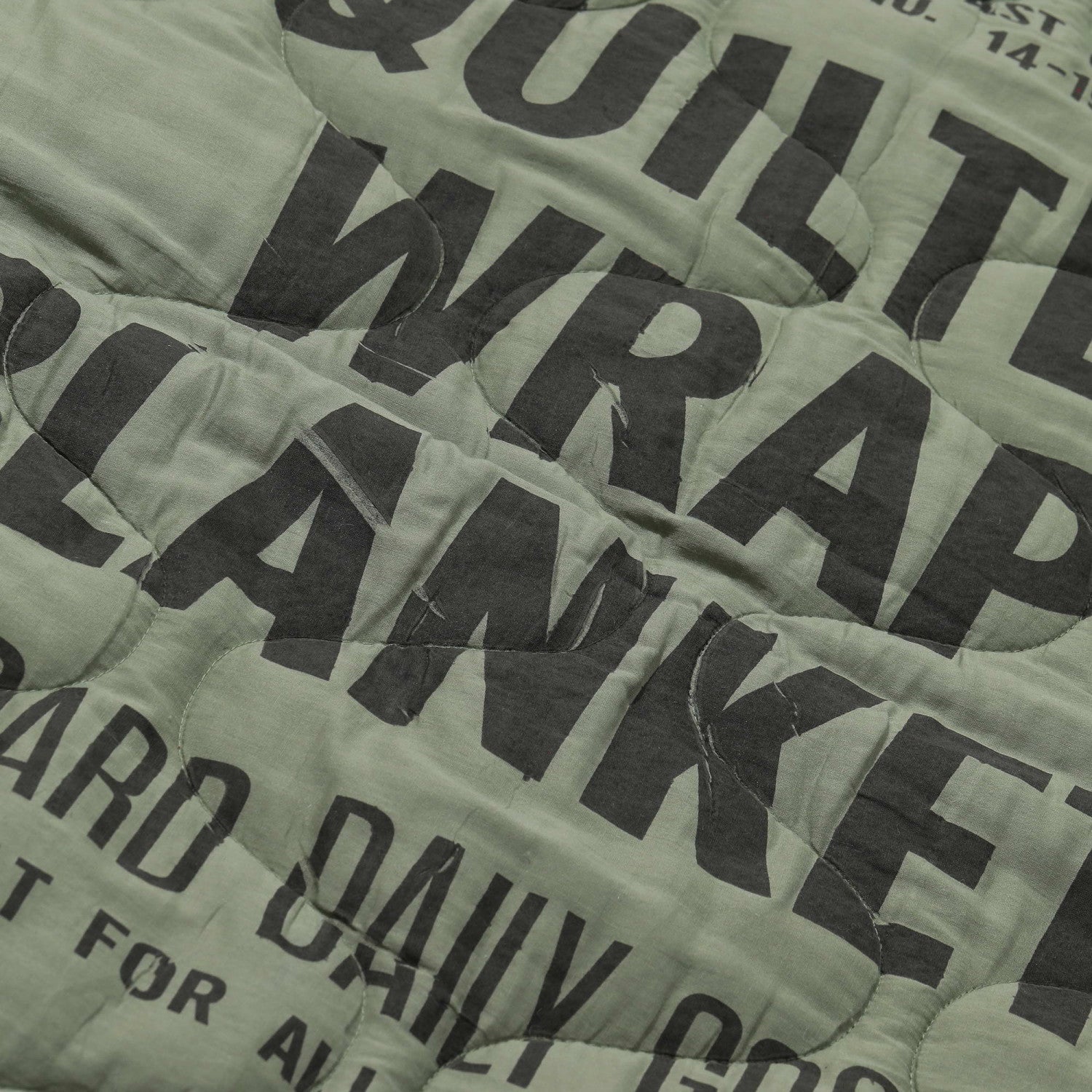 MADNESS x PUEBCO QUILTED WRAP BLANKET