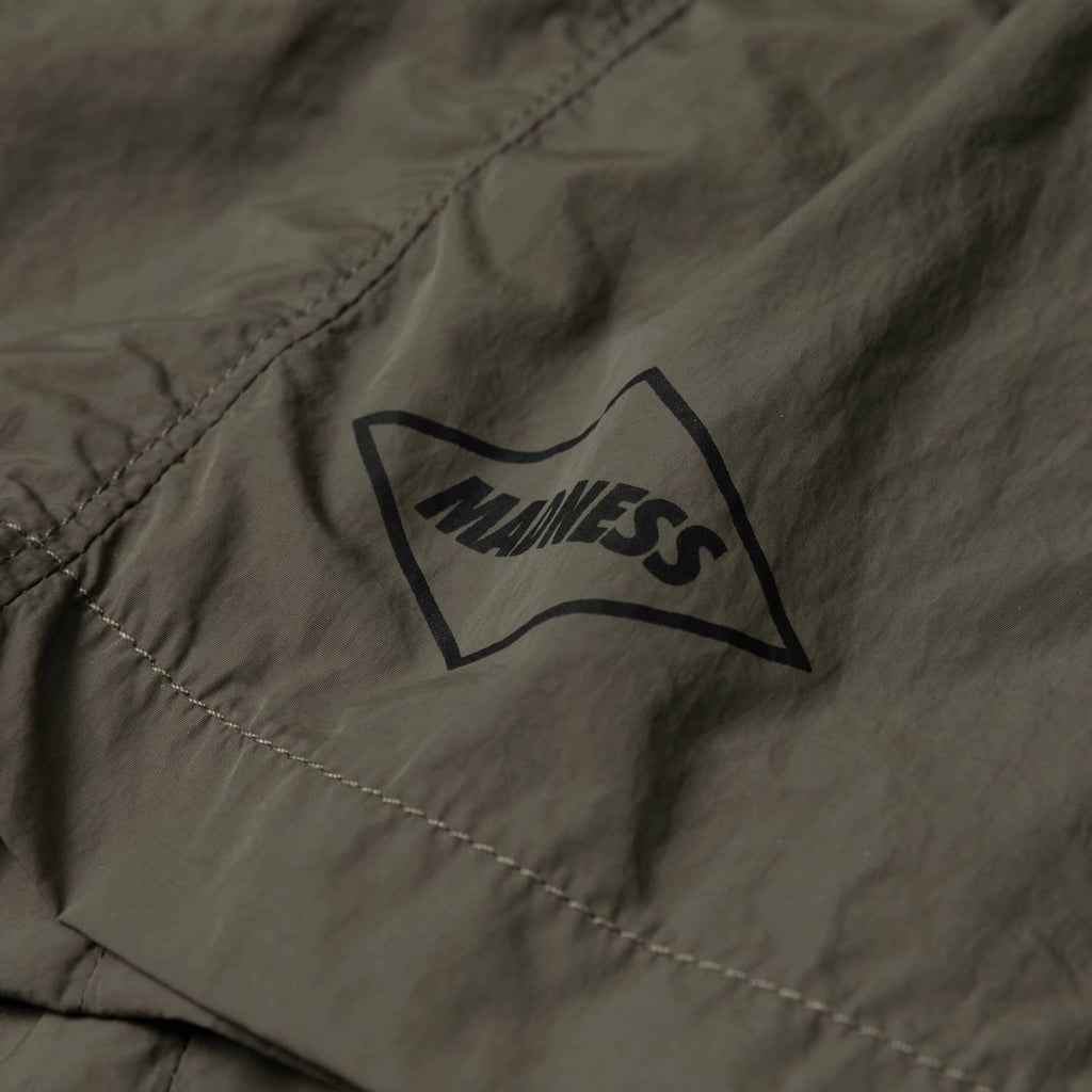 MADNESS LOGO NYLON SHORTS
